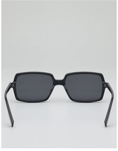 Detail view of high-quality black square sunglasses with grey lenses and hinge structure