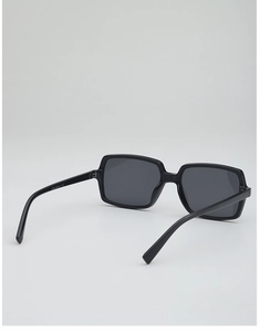 Detail view of square black frame sunglasses showing hinge structure and temple marking