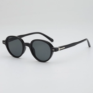 Classic black round sunglasses with glossy resin frame and silver arrow hinge detail