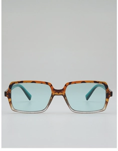 Close-up of square sunglasses with tortoiseshell gradient frames and light blue lenses
