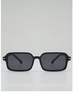 Close-up of black square sunglasses with dark gray lenses and silver metal hinge details