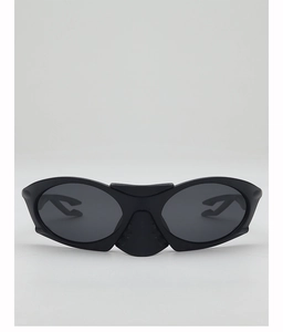 Detail showing the futuristic matte black wrap-around frame and dark grey lenses