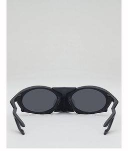 Rear view of futuristic black matte over-the-top sports sunglasses with dark grey lenses