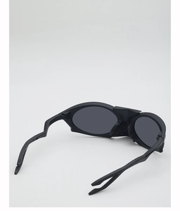 Detail view of matte black aerodynamic frame and polarized lenses on sports sunglasses
