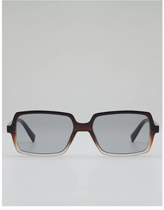 Detail view of large rectangular sunglasses featuring gradient brown frames and grey lenses
