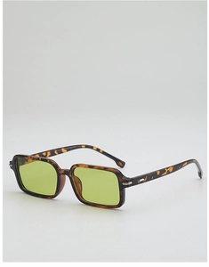 Detail of retro tortoiseshell sunglasses with yellow lenses and silver metal hinges