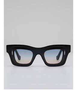 Detail of square black frame sunglasses with blue-pink gradient lenses and silver rivets