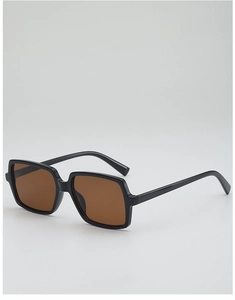 Detail of vintage oversized square sunglasses with black frame and brown tinted lenses