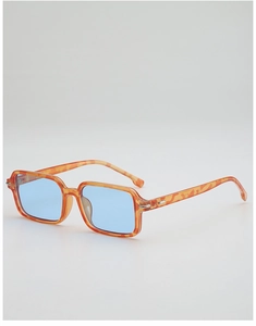 Detail view of tortoiseshell square sunglasses with light blue lenses and metal hinges
