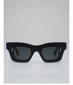 Detail of black rectangular sunglasses with silver metal accents and dark grey lenses