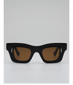 Detail of square frame sunglasses with silver rivets and premium acetate texture