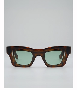Detail of tortoise shell rectangle sunglasses with green lenses and silver metal rivets