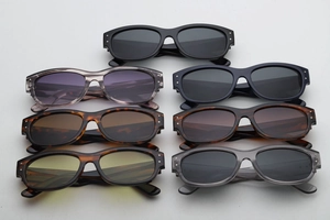 Collection of retro thick-frame sunglasses in various colors and patterns displayed on a plain background