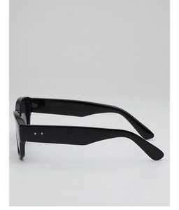 Detail of glossy black sunglasses frame with stylish silver rivets on wide temples
