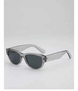Detail view of translucent grey frame and dark lenses on retro square sunglasses