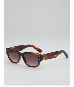 Detail of tortoise shell frame sunglasses with silver dots and gradient brown lenses