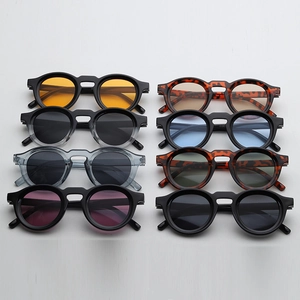 Detail view of various retro round sunglasses in different frame and lens color options