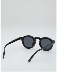 Detailed view of black round frame sunglasses with CY5522 model marking on the inner temple
