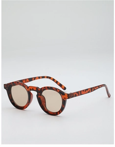 Detailed top view of retro round sunglasses featuring tortoise shell frames and brown lenses