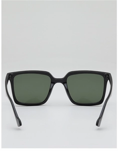 Detailed back view of oversized black square sunglasses with dark olive green lenses