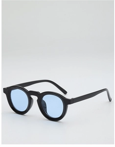 Detailed side view of vintage round sunglasses with black frame and light blue lenses