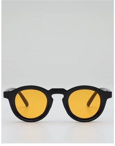 Close-up of vintage round sunglasses with a thick black frame and bright orange lenses