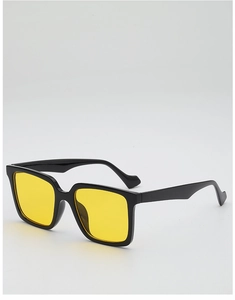Macro detail of retro large frame sunglasses featuring yellow lenses and black glossy frame