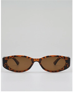 Detail view of retro oval sunglasses with tortoiseshell texture and dark brown lenses