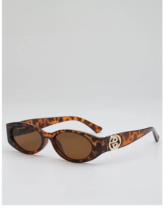 Detail of tortoise shell oval sunglasses with elegant gold link hinge on the temple
