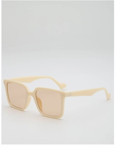 Side view of cream oversized square sunglasses featuring translucent amber lenses