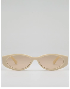 Detail view of oval retro sunglasses with cream frame and translucent brown lenses