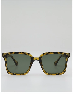 Macro detail of retro oversized square sunglasses featuring tortoise shell pattern frames
