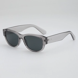 Vintage small frame translucent gray sunglasses with rivets and UV protection lenses