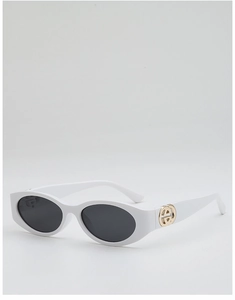 Detail view of oval white sunglasses with interlocking gold metal buckle on the temple