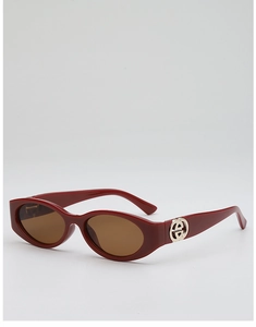 Detail of burgundy oval sunglasses with silver metal logo on the temple and brown lenses