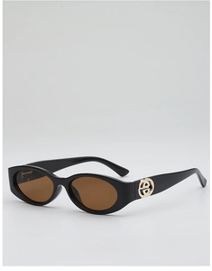 Detail of black oval frame sunglasses with gold interlocking logo and brown lenses