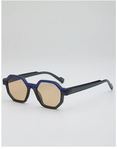 Detail view of hexagonal sunglasses with translucent grey frame and blue top stripe