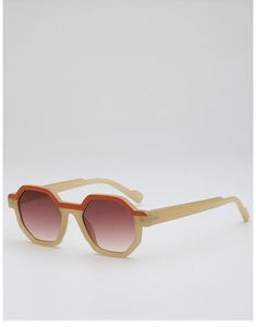 Detail view of stylish beige and orange geometric sunglasses with gradient brown lenses