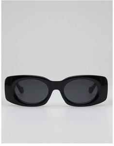 Front view of black thick-frame rectangle sunglasses with dark UV400 lenses on gray background