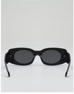 Detail view of bold black wide-frame sunglasses with dark grey UV400 protective lenses