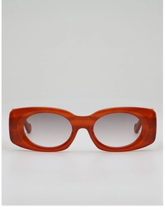 Detail view of vintage amber thick-frame sunglasses with high-quality gradient lenses