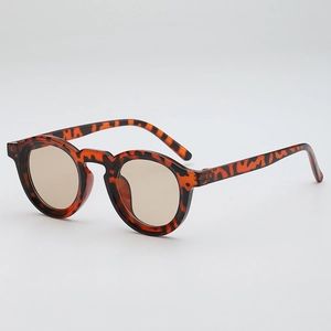 Retro round tortoise shell sunglasses with brown lenses shown from a 45-degree angle