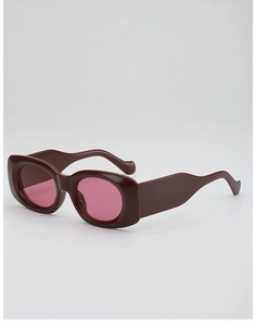 Detail of wide frame oval sunglasses with dark brown resin and light pink lenses