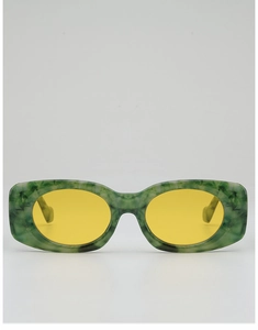 Detail of chunky rectangular green marble frame sunglasses with vibrant yellow lenses