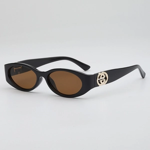 Retro oval black sunglasses with brown lenses and gold metal accents, 45-degree angle