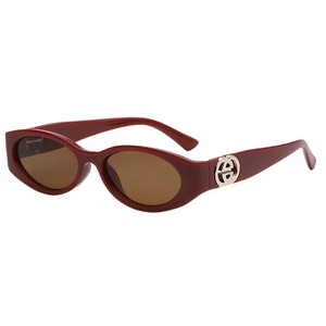 Retro oval burgundy sunglasses with thick frames and silver temple accents for women