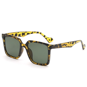 Retro oversized square tortoiseshell sunglasses with green lenses and heart detail