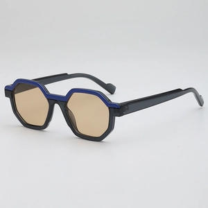 Polygonal UV400 sunglasses with translucent blue-topped black frames and amber lenses