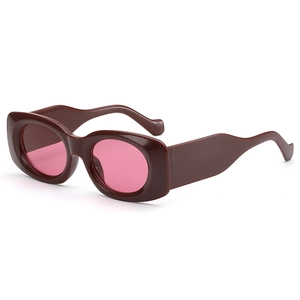 Chunky frame sunglasses with wave temples and pink lenses in Y2K vintage style