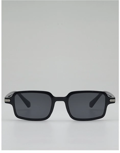 Detail of vintage black rectangular sunglasses with silver metal hinge accents and grey lenses